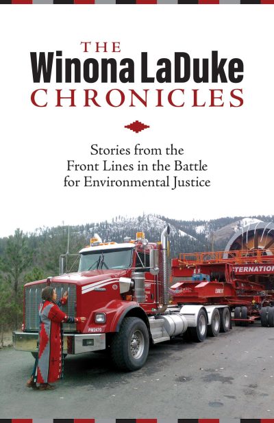Book cover for "The Winona LaDuke Chronicles" featuring a red truck and logging equipment with forested mountains in background.