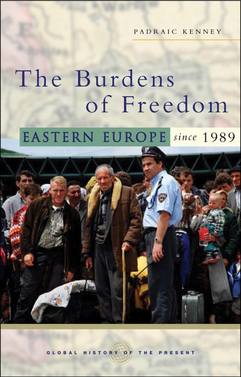 Book cover for "The Burdens of Freedom: Eastern Europe since 1989" by Padraic Kenney showing a group of people at what appears to be a historical gathering or event.