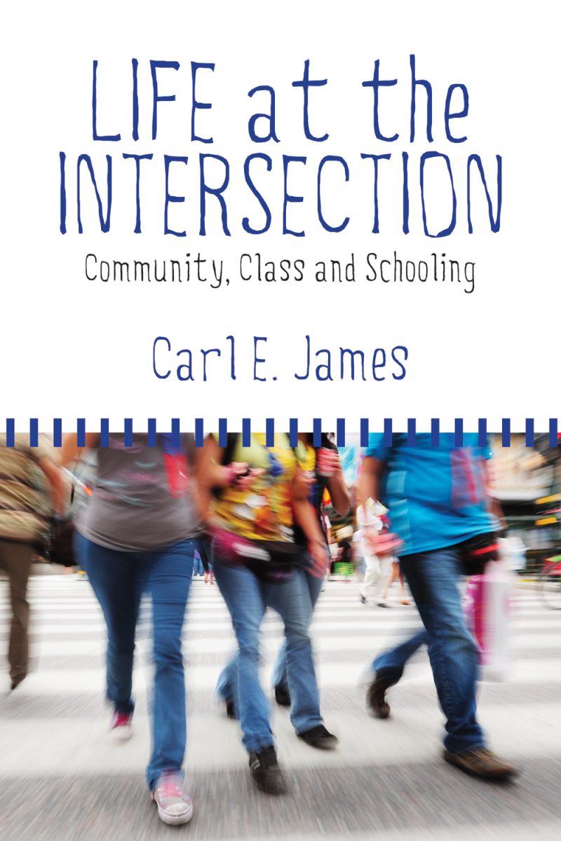 Book cover showing blurred people walking, titled "Life at the Intersection" by Carl E. James with subtitle "Community, Class and Schooling"