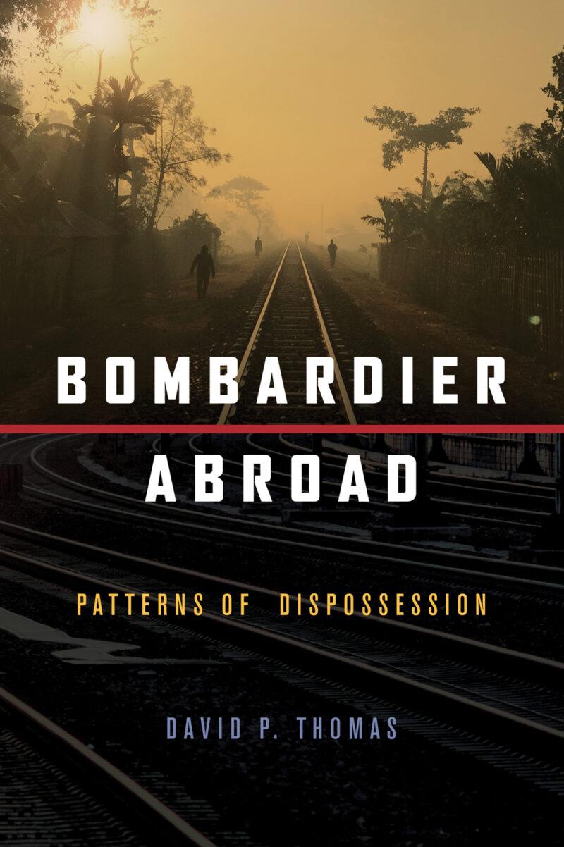 Book cover for "Bombardier Abroad" by David P. Thomas featuring railroad tracks in misty tropical landscape with silhouetted figures.