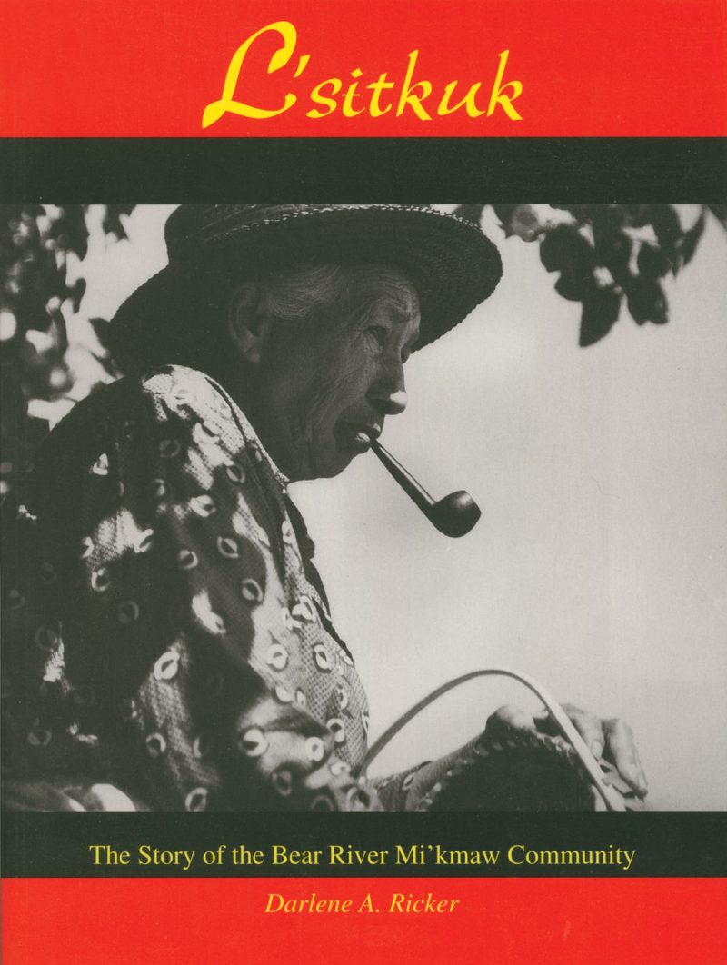Book cover for "L'sitkuk" by Darlene A. Ricker, featuring a black and white photograph of a person wearing a hat and patterned shirt smoking a pipe.
