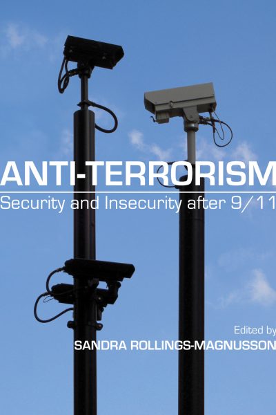 Surveillance cameras mounted on poles against blue sky, with book title "Anti-Terrorism: Security and Insecurity after 9/11" overlaid.