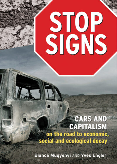 Book cover titled "Stop Signs: Cars and Capitalism" featuring a burnt-out vehicle in a desert landscape with gray sky.