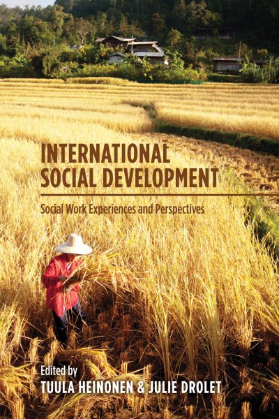 Book cover showing a person harvesting grain in a field with a house and forest in the background.