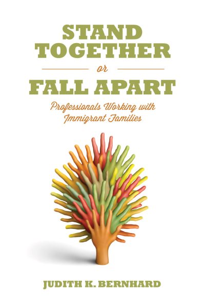 Book cover titled "Stand Together or Fall Apart" with a colorful tree illustration made of multicolored fingers in red, orange, yellow, and green tones.