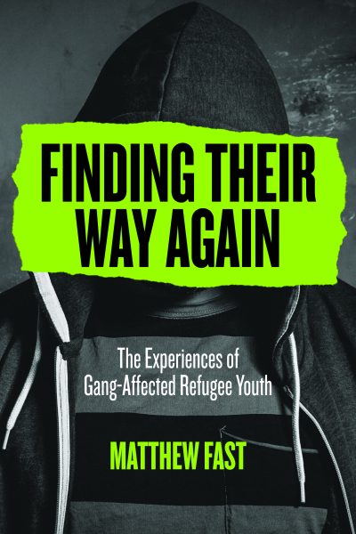 Book cover with a person in dark hoodie against gray background, bright neon green text reading "Finding Their Way Again: The Experiences of Gang-Affected Refugee Youth" by Matthew Fast.