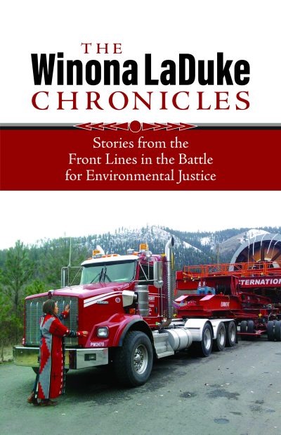 Book cover for "The Winona LaDuke Chronicles" featuring a red truck and person at a mountain logging site.