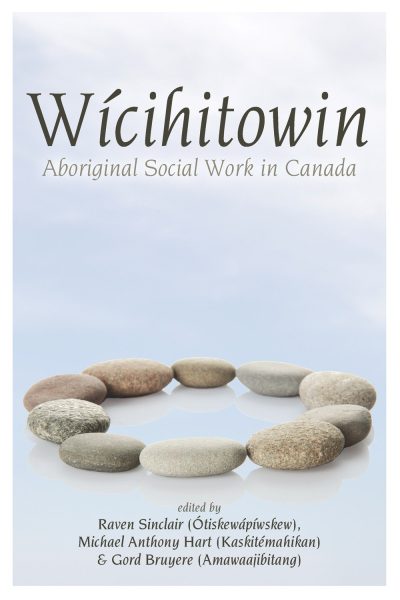 Book cover for "Wicihitowin: Aboriginal Social Work in Canada" featuring stones arranged in a circle against a cloudy sky background.