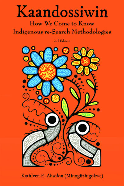 Book cover of "Kaandossiwin: How We Come to Know Indigenous re-Search Methodologies" 2nd Edition, featuring stylized flowers and roots on orange background.
