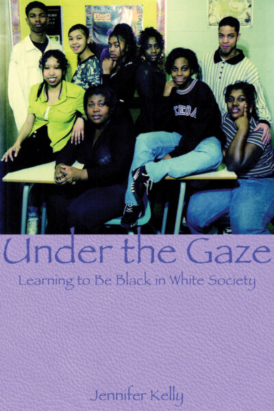 Book cover "Under the Gaze: Learning to Be Black in White Society" by Jennifer Kelly, showing a group of nine young people posing together indoors.