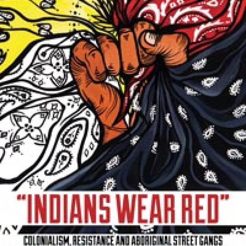 Colorful graphic poster with red, yellow, and black butterfly wings and text reading "Indians Wear Red" promoting indigenous resistance and solidarity.